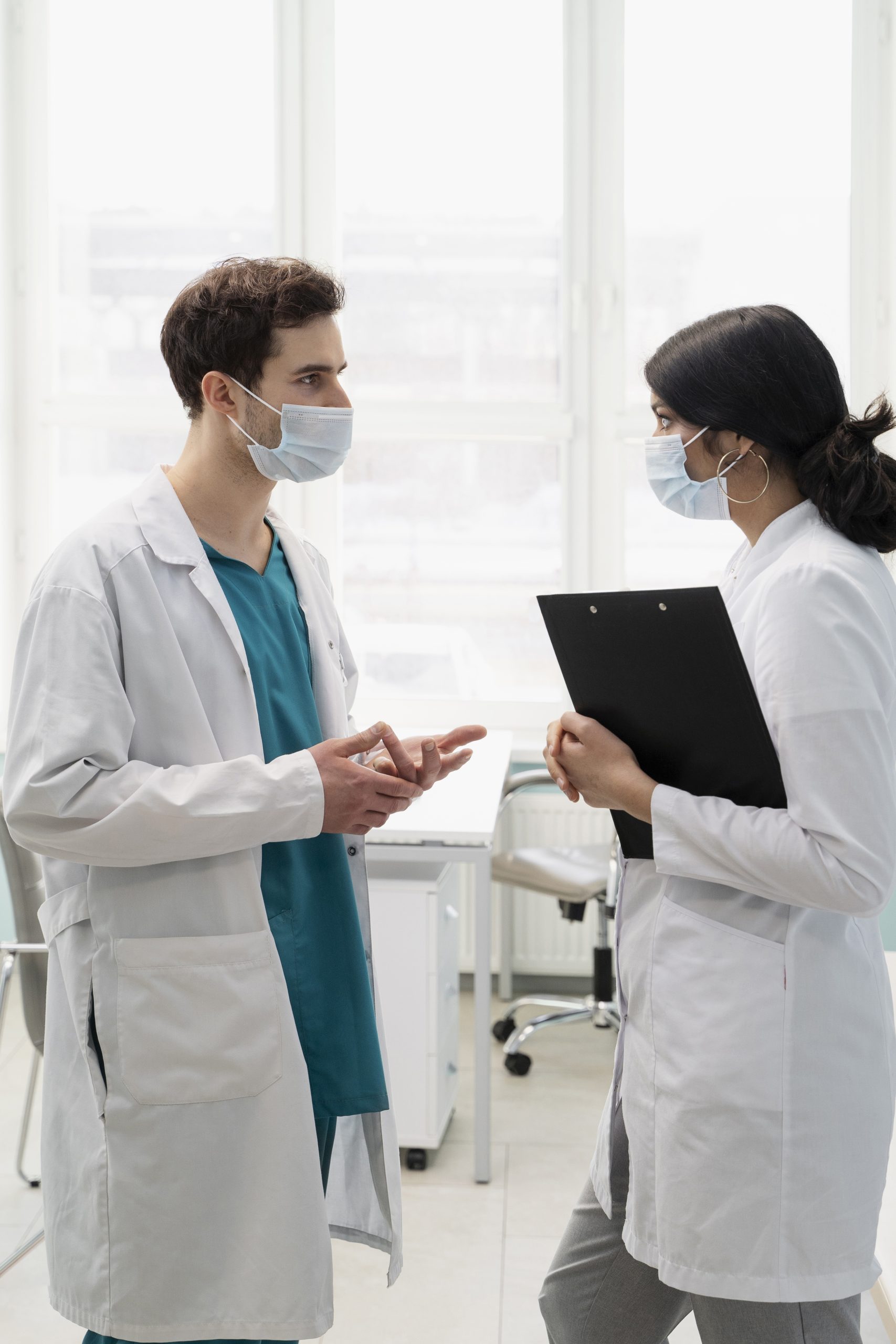 medium shot doctors wearing face masks